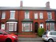 This traditional mid terraced house has accommodation comprising hall,  lounge